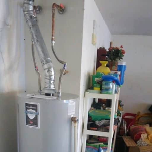 New water heater install with pan, drain, vent, and all new connections.